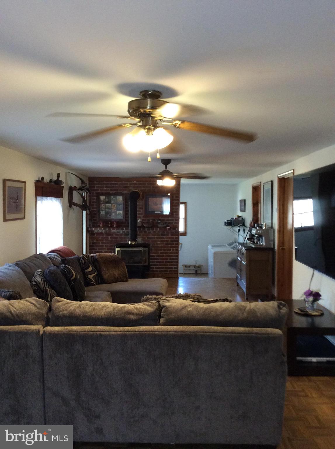 319 Red Lion Branch Road Millington, MD 21651 - Photo 8 of 31 a living room with furniture and a chandelier