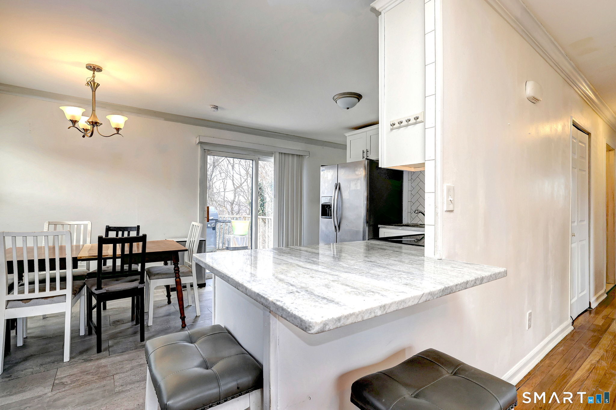 42 Highland Avenue Ansonia, CT 06401 - Photo 11 of 40 a kitchen with a table chairs and entryway