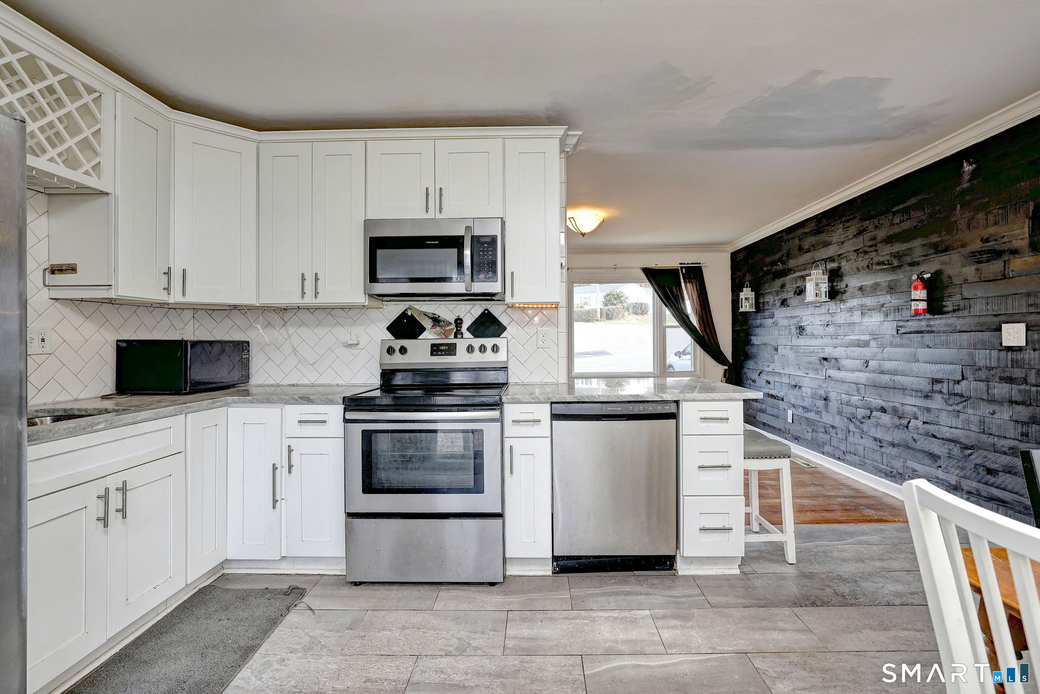 42 Highland Avenue Ansonia, CT 06401 - Photo 15 of 40 a kitchen with stainless steel appliances granite countertop a stove and a sink