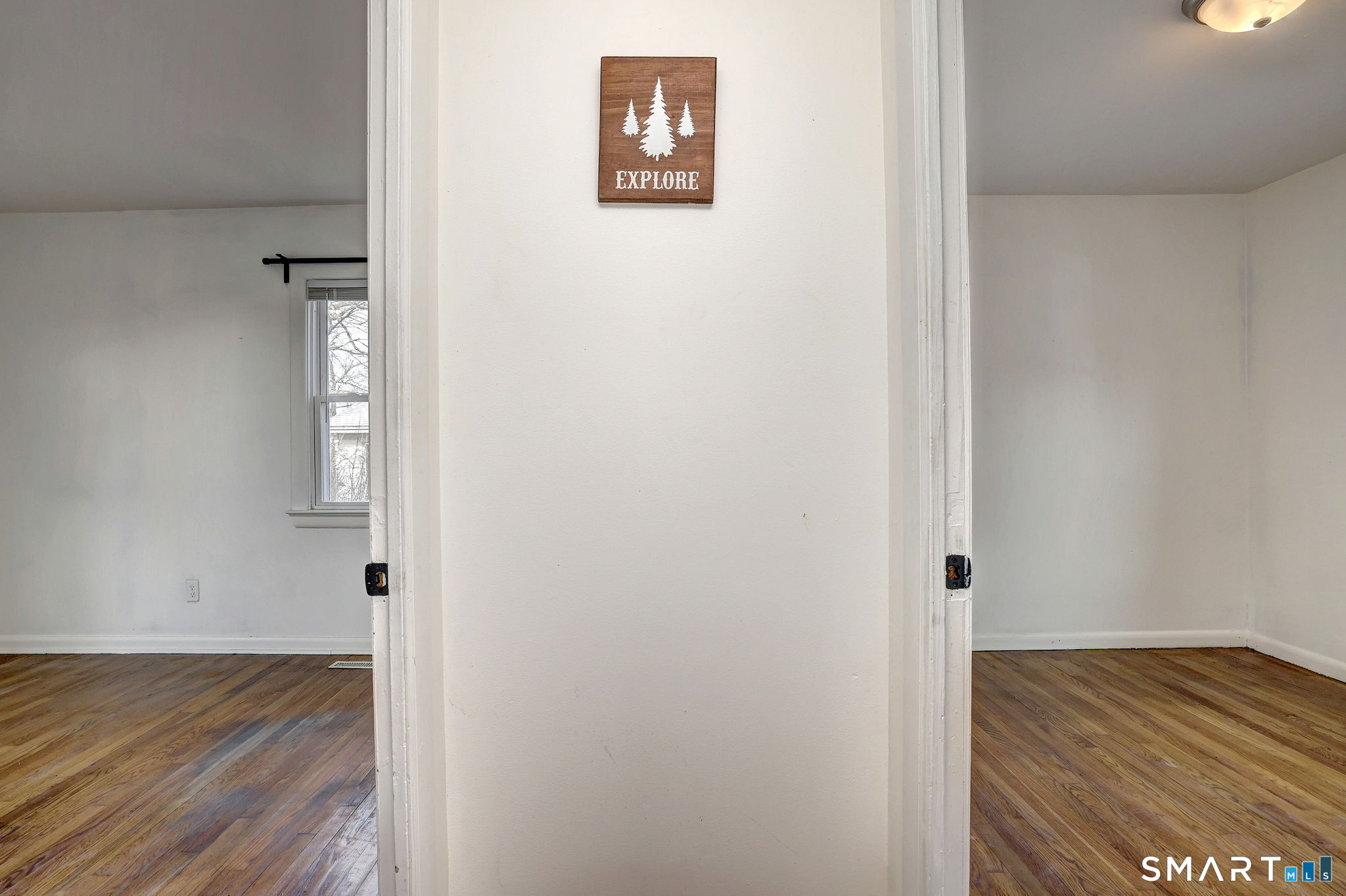 42 Highland Avenue Ansonia, CT 06401 - Photo 22 of 40 a view of a hallway with wooden floor and closet