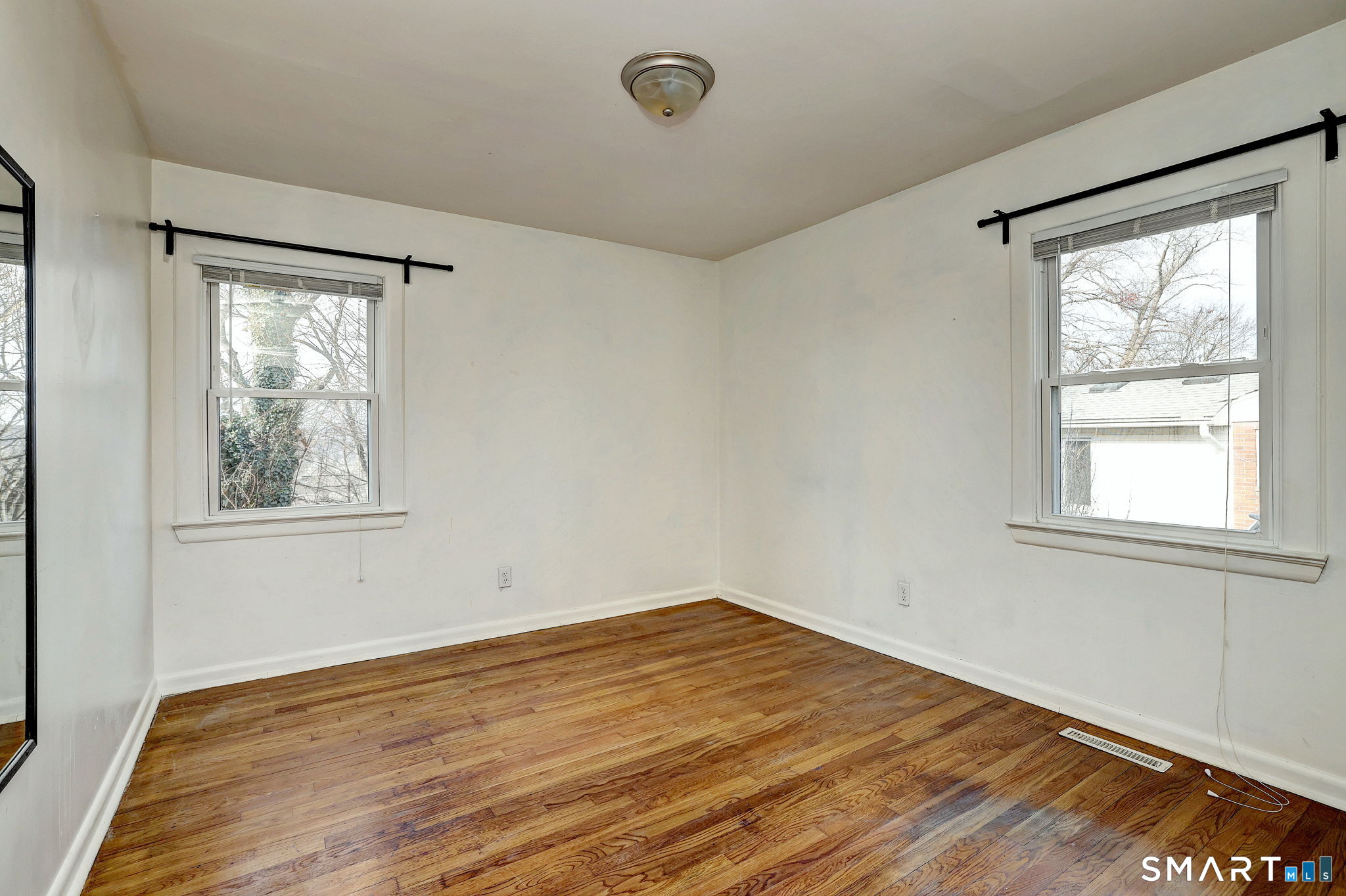 42 Highland Avenue Ansonia, CT 06401 - Photo 23 of 40 a view of empty room with wooden floor and fan