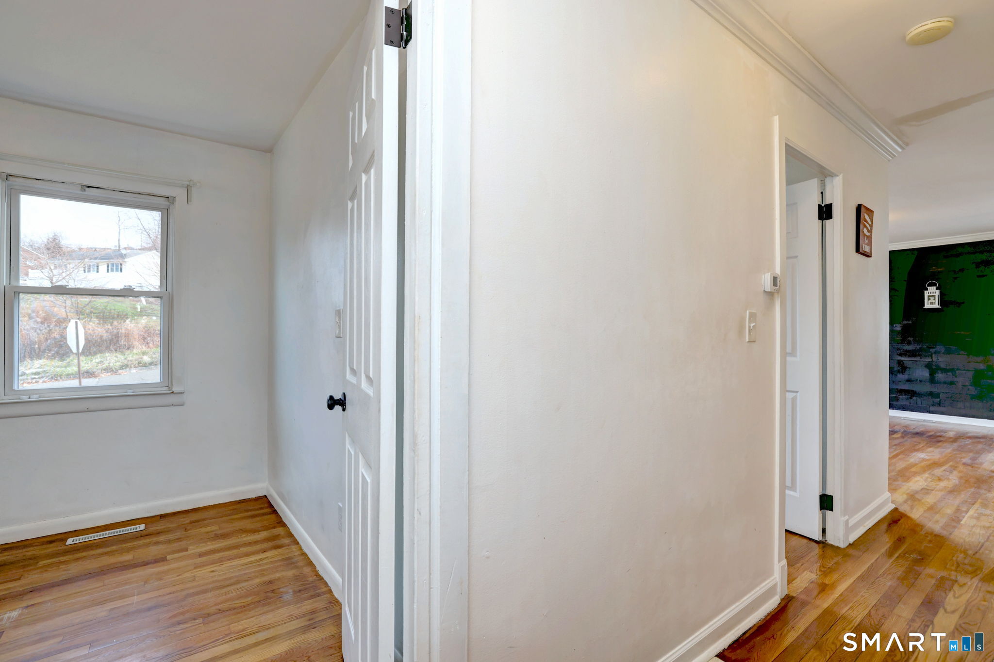 42 Highland Avenue Ansonia, CT 06401 - Photo 26 of 40 a view of a hallway with wooden floor and closet