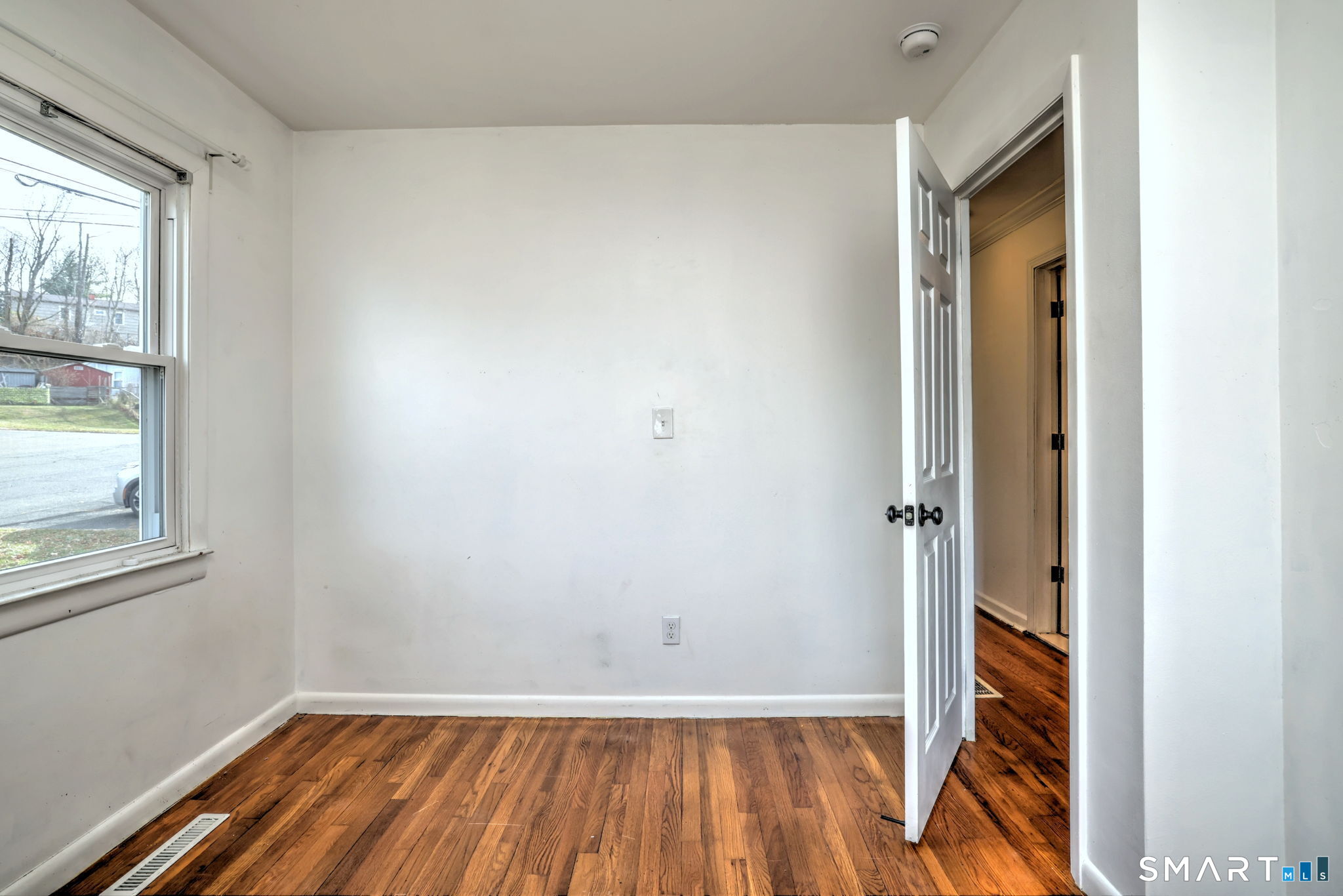 42 Highland Avenue Ansonia, CT 06401 - Photo 28 of 40 a view of an empty room with wooden floor and a window