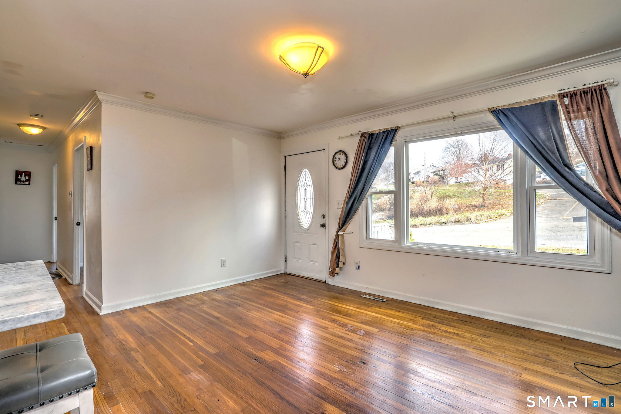 42 Highland Avenue Ansonia, CT 06401 - Photo 7 of 40 a view of empty room with wooden floor and fan