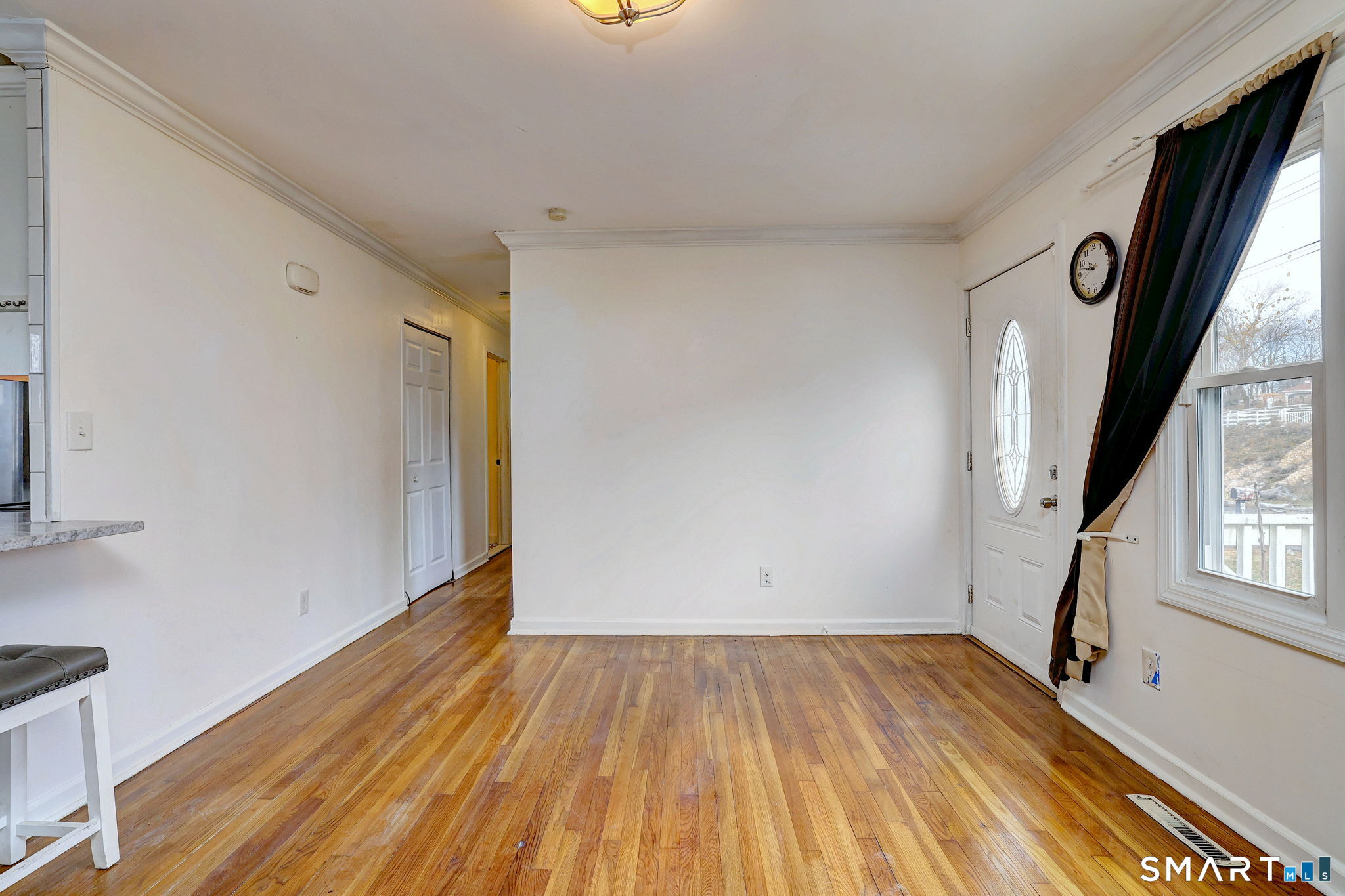 42 Highland Avenue Ansonia, CT 06401 - Photo 8 of 40 a view of empty room with wooden floor and fan