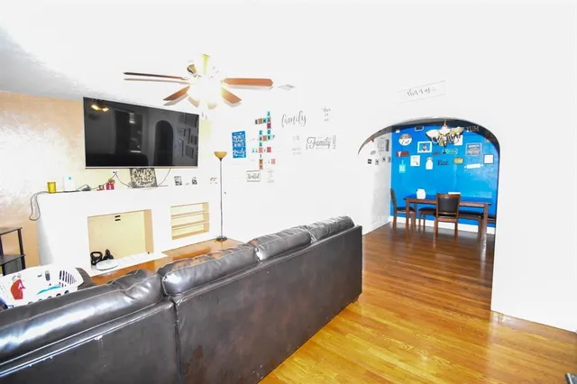 a living room with furniture and a flat screen tv