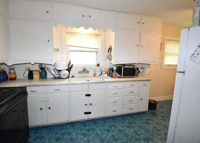 a bathroom with a double vanity sink and mirror