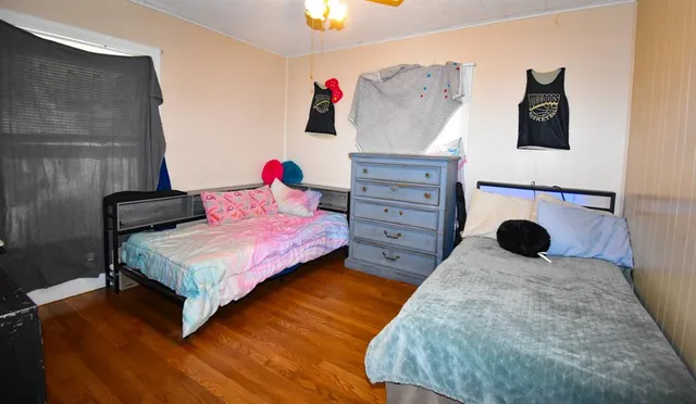 a bedroom with a bed and a lamp