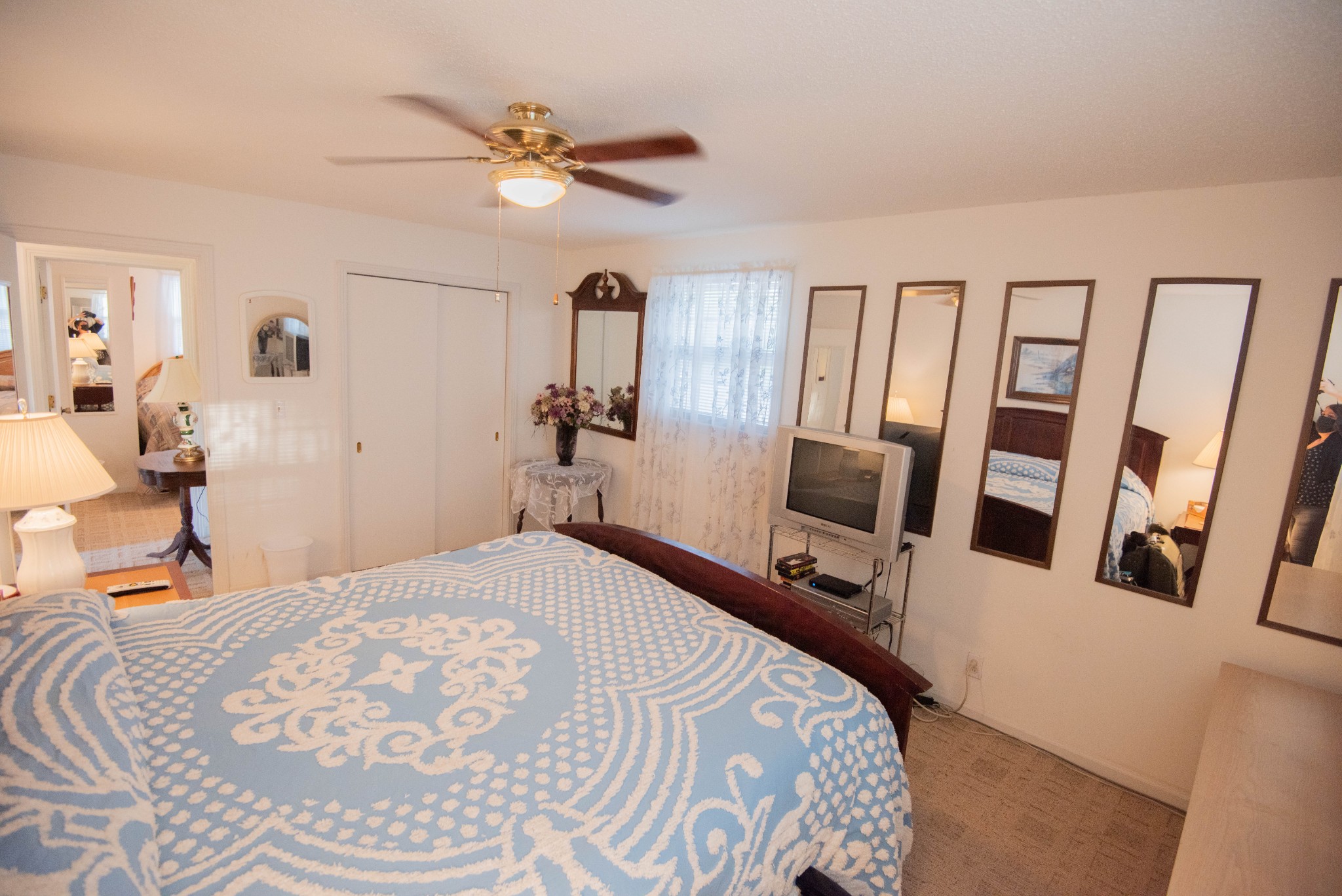 205 Green Harbor Road Old Hickory, TN 37138 - Photo 13 of 36 a bedroom with a bed a mirror and a table in it