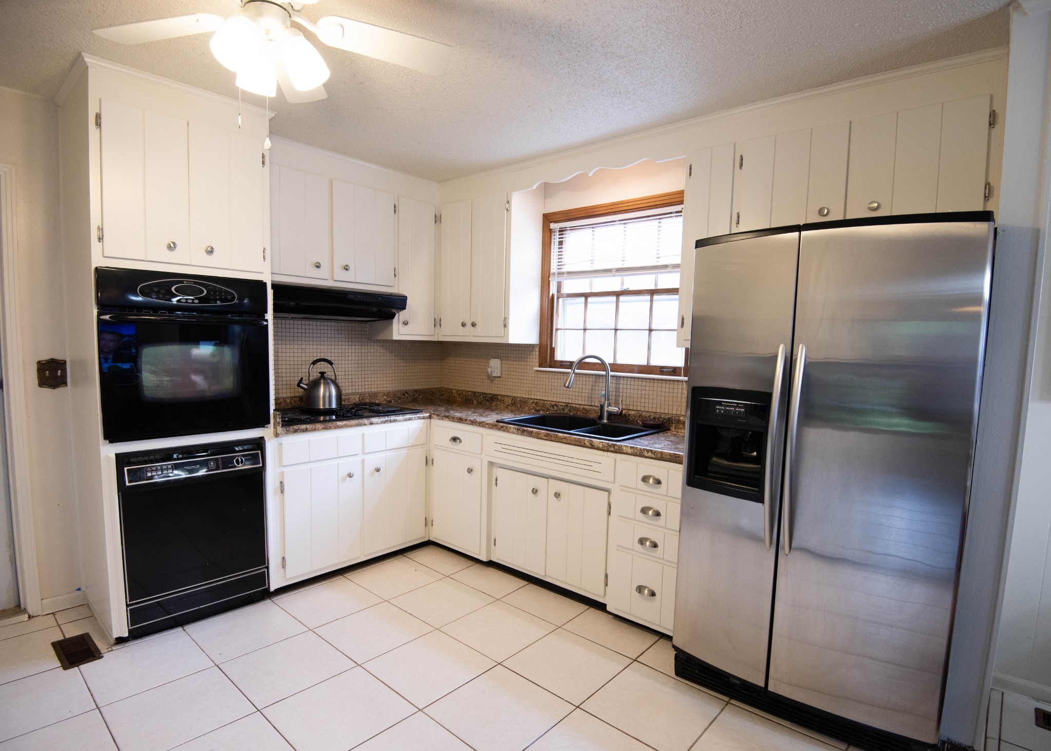 205 Green Harbor Road Old Hickory, TN 37138 - Photo 31 of 36 a kitchen with white cabinets and white appliances