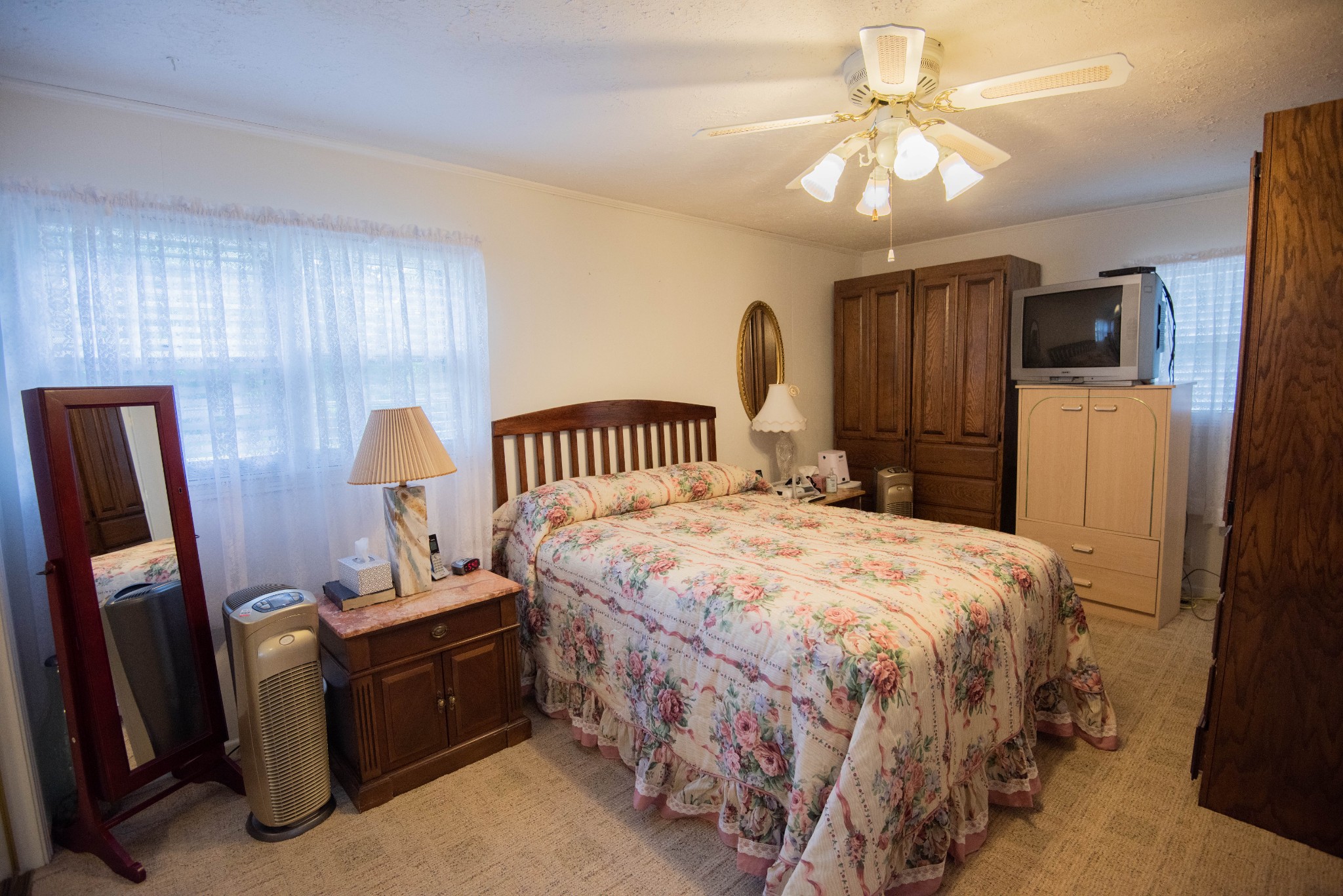 205 Green Harbor Road Old Hickory, TN 37138 - Photo 33 of 36 a bedroom with a bed and a chandelier