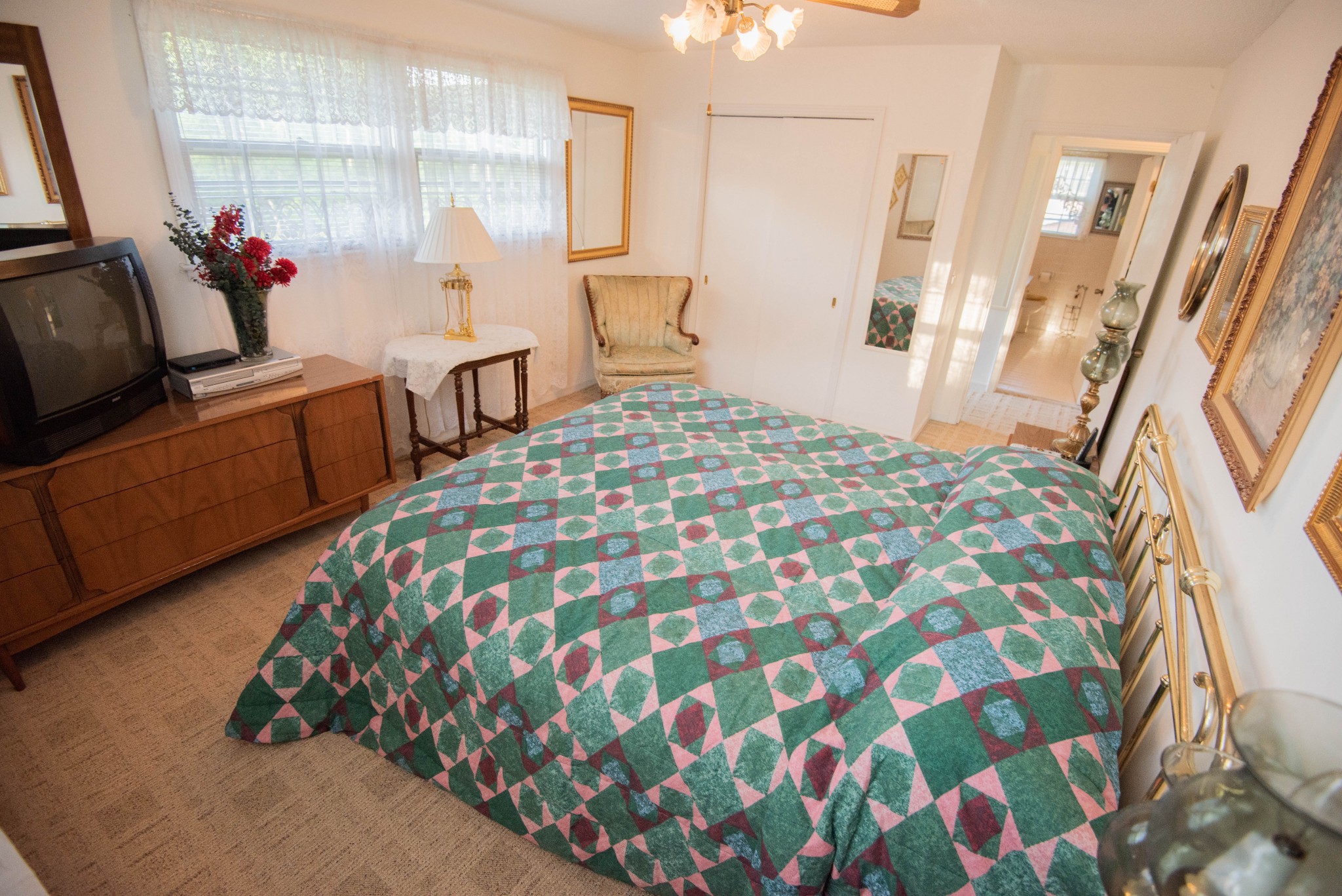205 Green Harbor Road Old Hickory, TN 37138 - Photo 5 of 36 a bedroom with a bed and a flat tv screen on the dresser