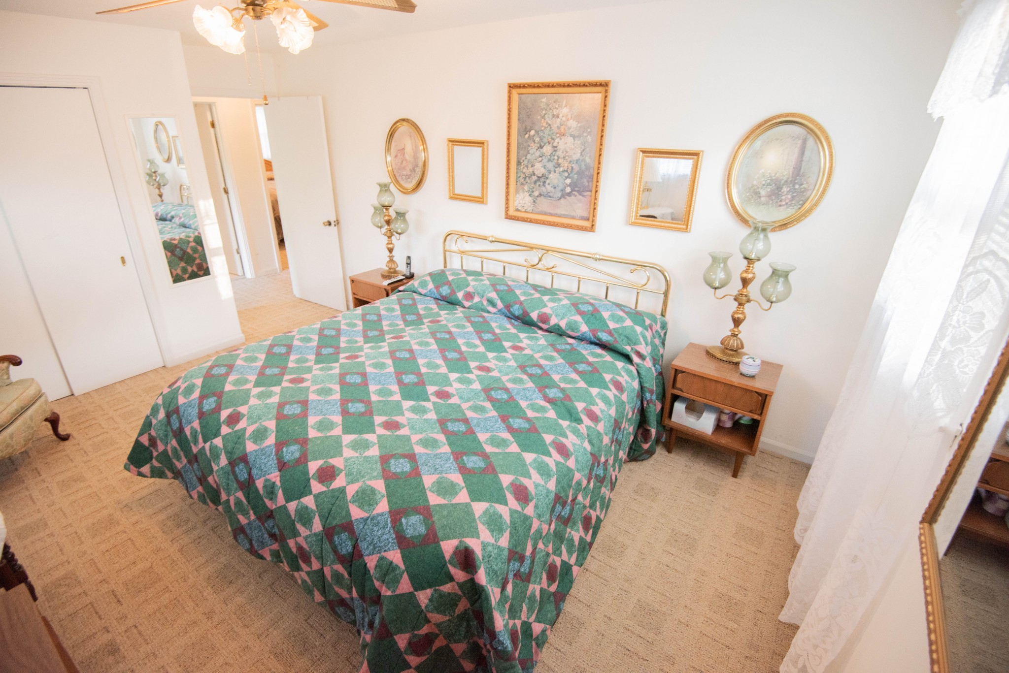 205 Green Harbor Road Old Hickory, TN 37138 - Photo 6 of 36 a bedroom with a bed and a chandelier