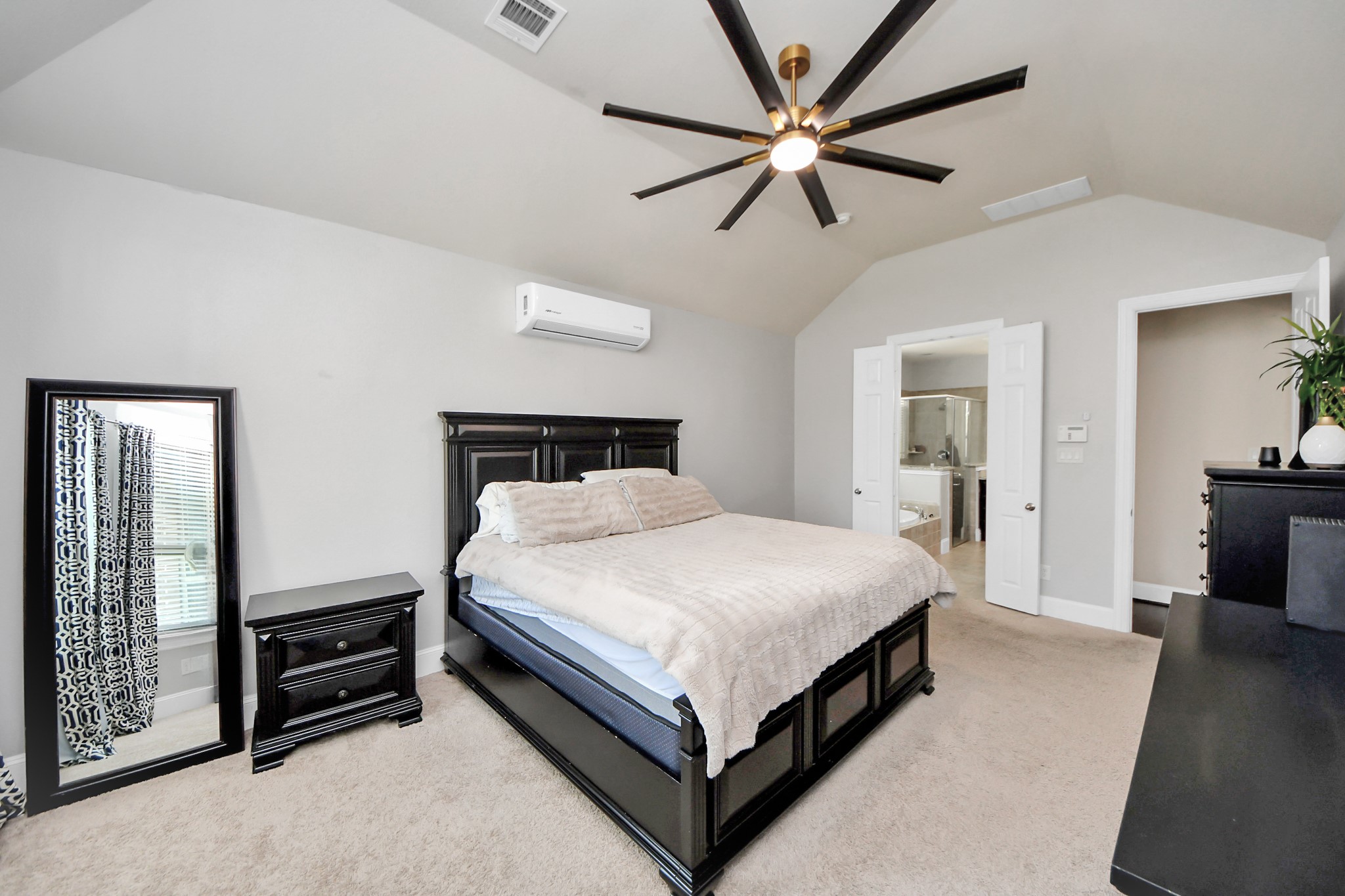 4811 Applewood Crest Lane Rosharon, TX 77583 - Photo 17 of 45 a bedroom with a bed and a chandelier