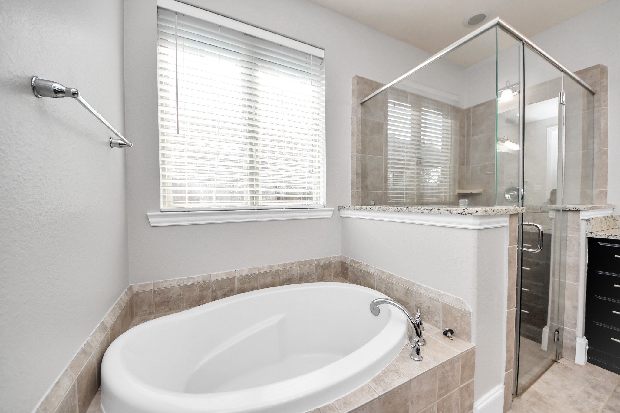 4811 Applewood Crest Lane Rosharon, TX 77583 - Photo 20 of 45 a bathroom with a bathtub and a window