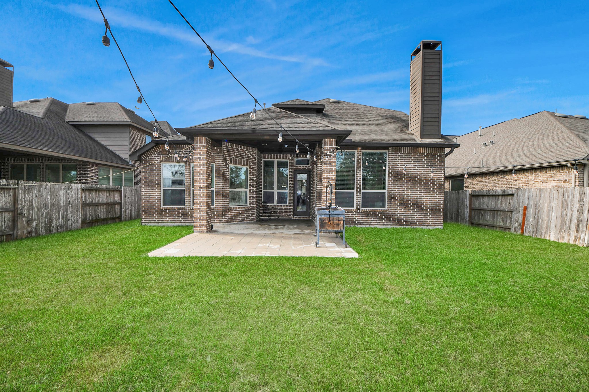 4811 Applewood Crest Lane Rosharon, TX 77583 - Photo 38 of 45 a front view of a house with a yard table and chairs