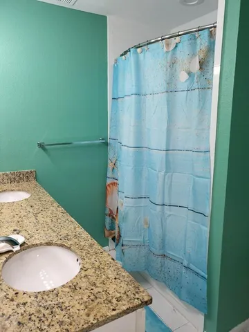 a bedroom with bed and window