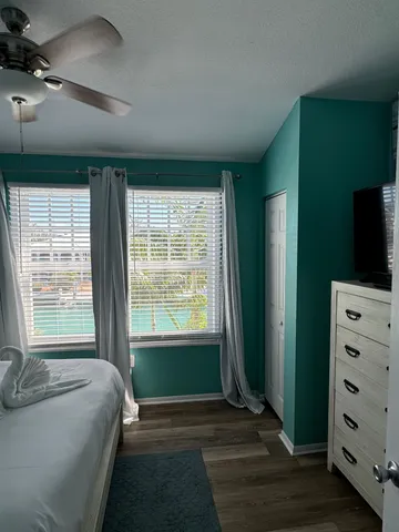 a bedroom with a large bed and a window