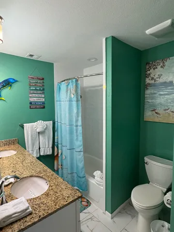 a close up of a toilet and a sink