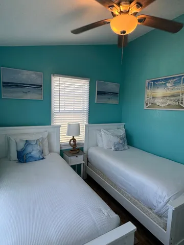 a bedroom with bed and window