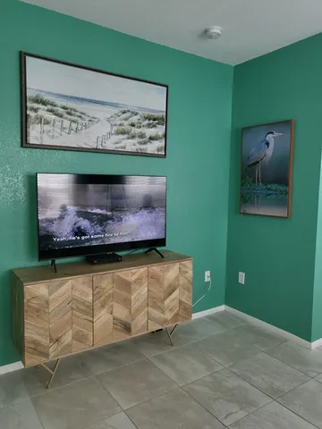 a kitchen with stainless steel appliances granite countertop a sink refrigerator and microwave