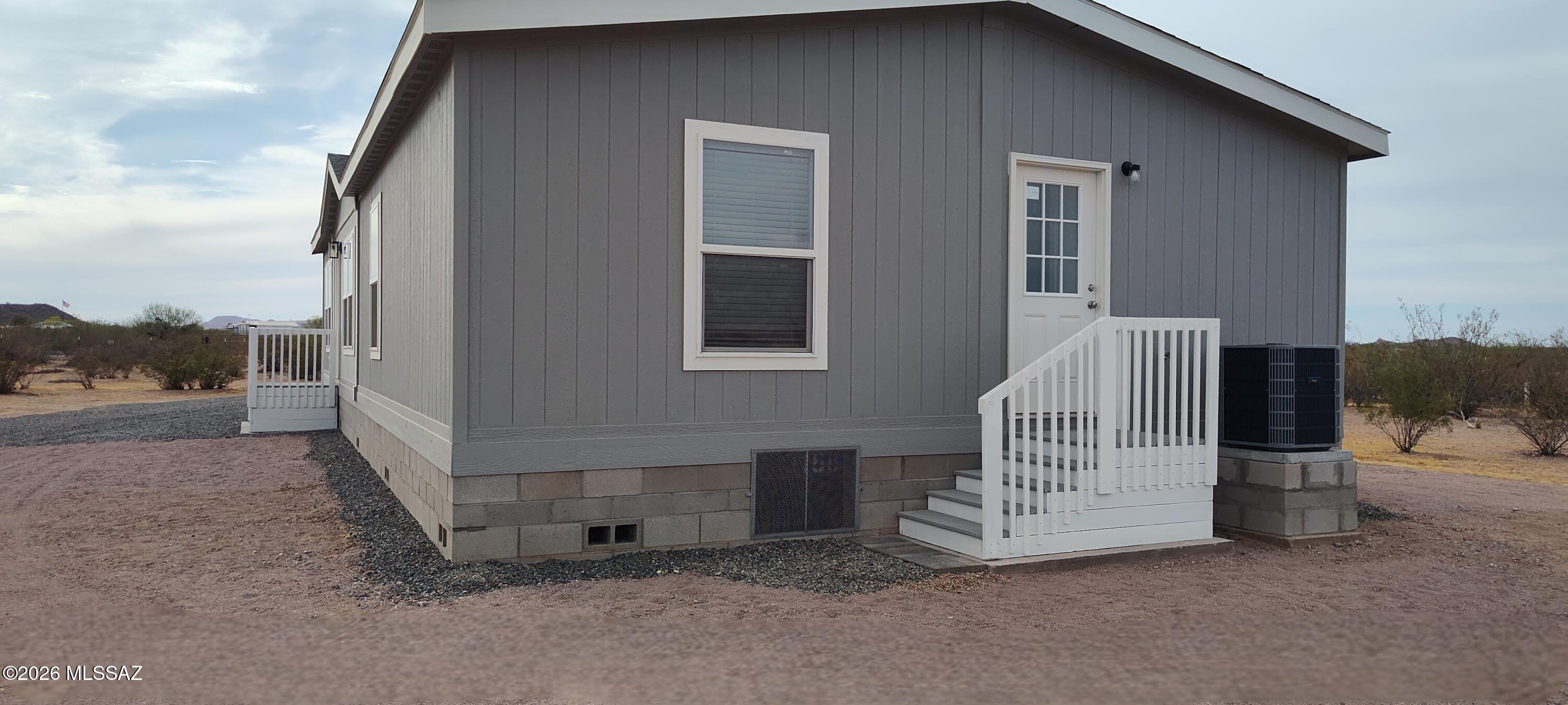 18565 West McClean Road Marana, AZ 85653 - Photo 3 of 37 a view of backyard with barbeque grill and a fireplace
