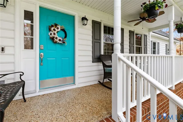 a view of an entryway with wooden floor