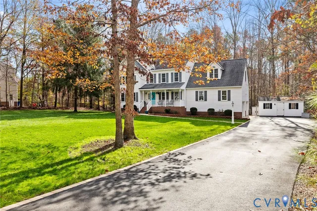 a front view of a building with a yard