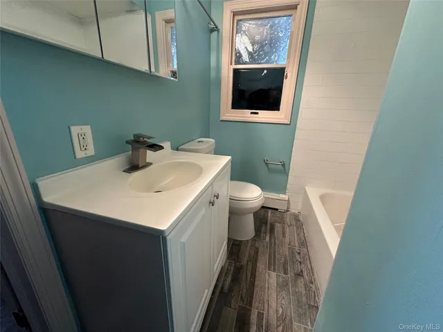 a bathroom with a sink and a toilet