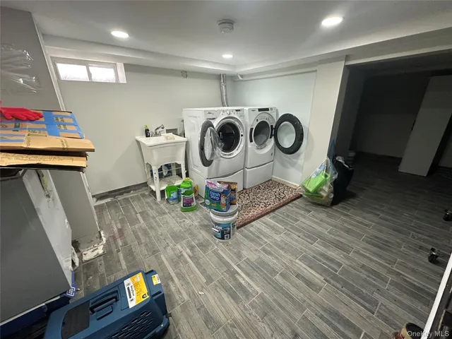 a room with gym equipment and wooden floor