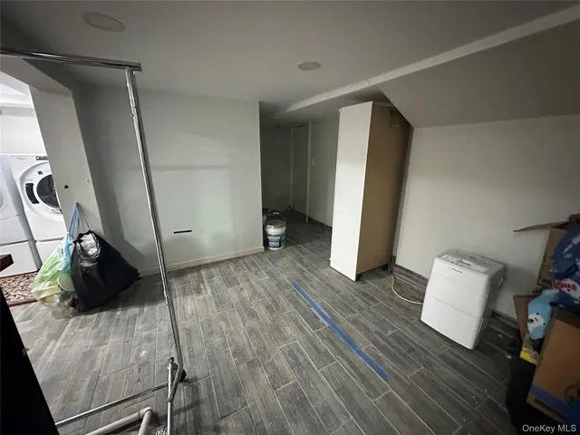 a view of an empty room and wooden floor