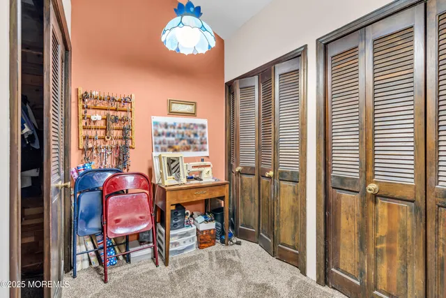 a dining room with furniture and a window