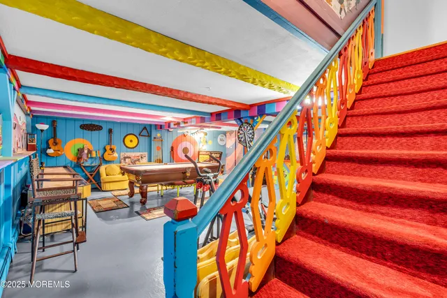 a utility room with wooden floor stairs and a stairs