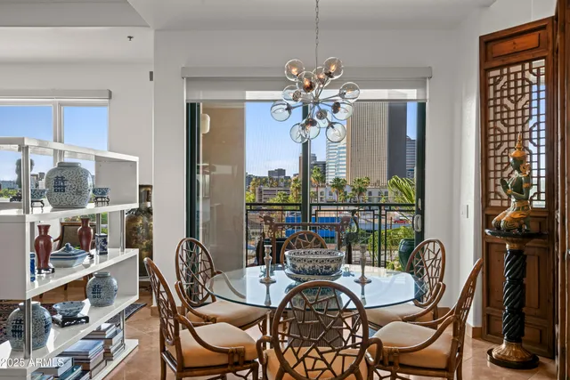 a living room with furniture lamp large window and a table