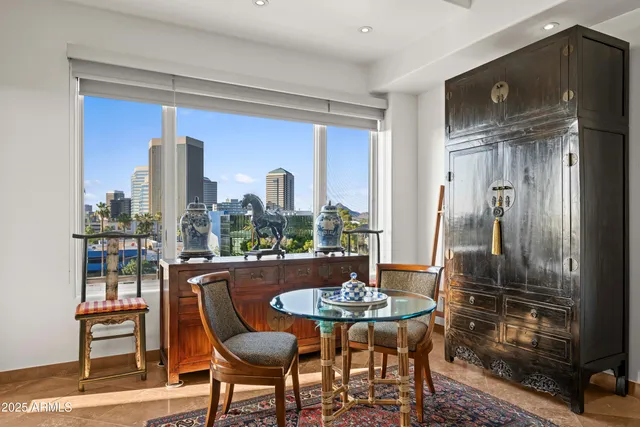 a bathroom with a granite countertop sink mirror and toilet