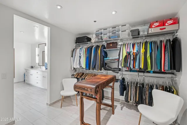 a view of living room with furniture and floor to ceiling window