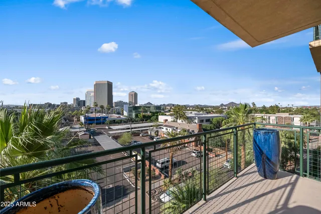 a view of a balcony with chairs