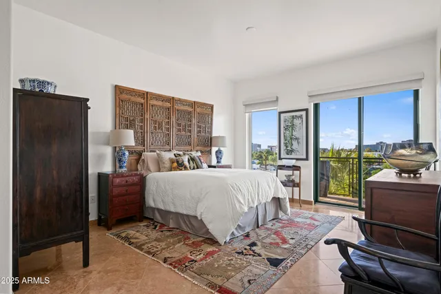 a view of a balcony with lake view and a potted plant