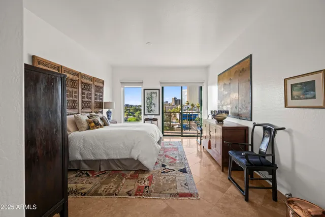 a spacious bathroom with a granite countertop sink toilet and mirror