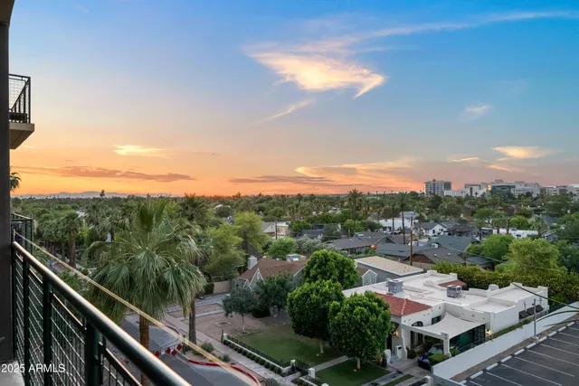 a view of a balcony with wooden floor and outdoor space