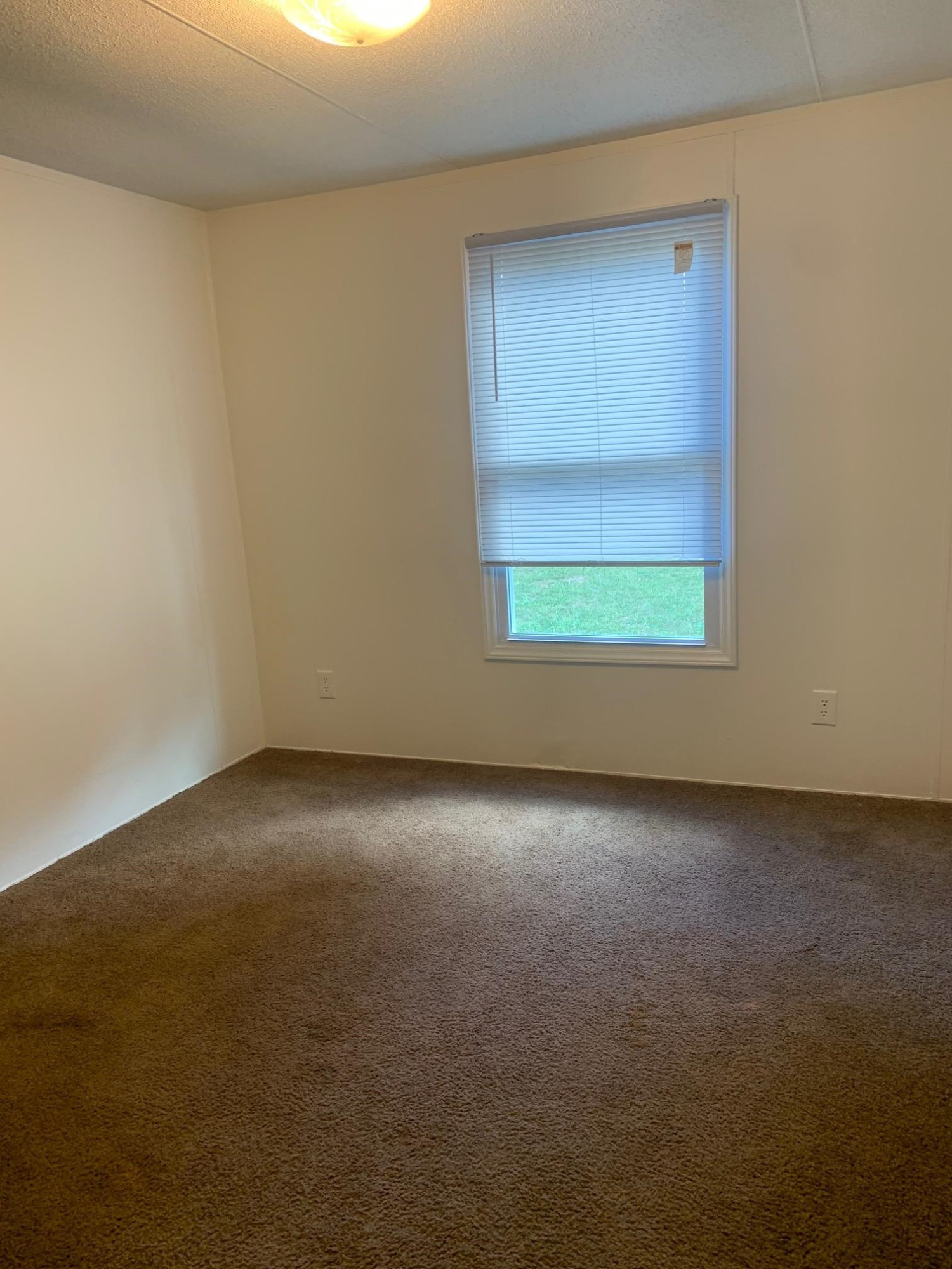 326 Everett Avenue Roxboro, NC 27574 - Photo 10 of 10 an empty room with a window
