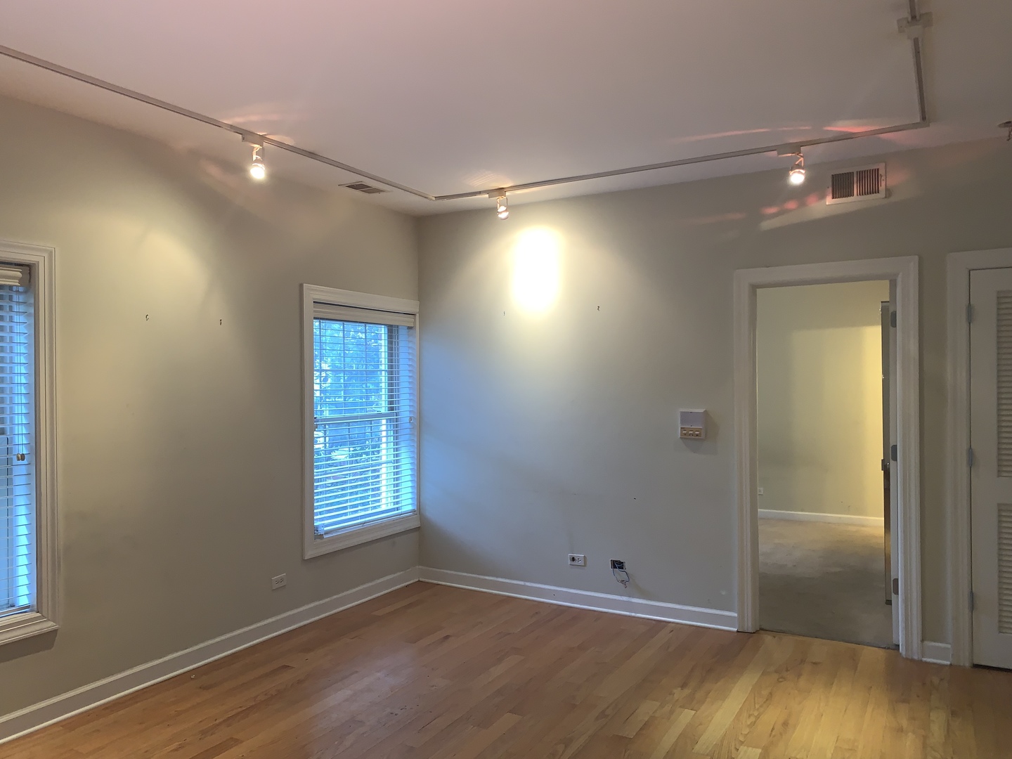 839 East 52nd Street, Unit 3 Chicago, IL 60615 - Photo 8 of 18 a view of an empty room with wooden floor and a window