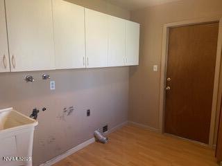 908 Wagner Drive Carson City, NV 89703 - Photo 5 of 8 a bathroom with a sink and cabinets