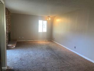 908 Wagner Drive Carson City, NV 89703 - Photo 6 of 8 en empty room with windows and yard