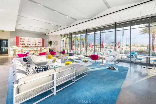 a playing room with furniture and a large window