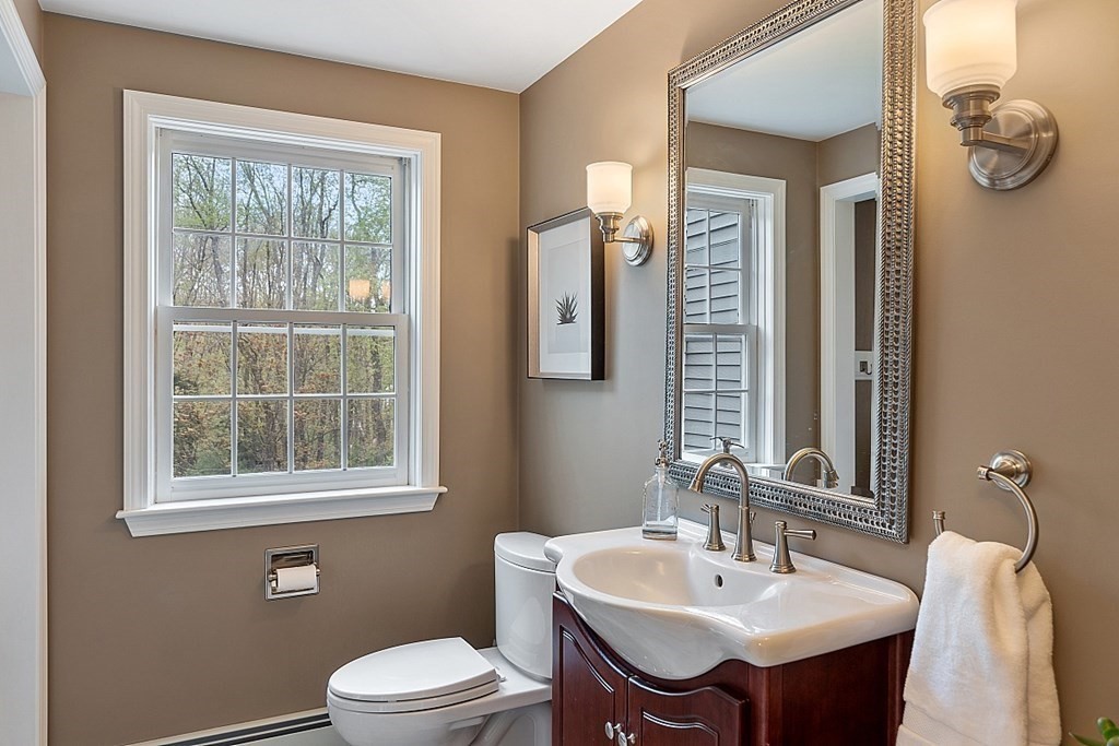 7 Cameron Road Harvard, MA 01451 - Photo 15 of 42 a bathroom with a sink a toilet and mirror