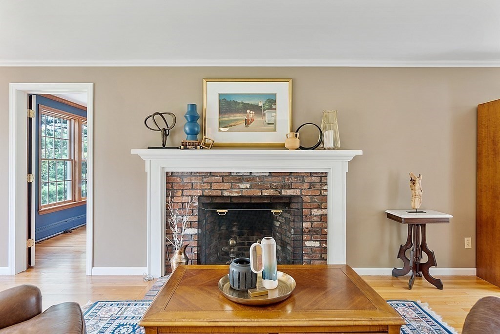 7 Cameron Road Harvard, MA 01451 - Photo 18 of 42 a living room with furniture a fireplace and a table