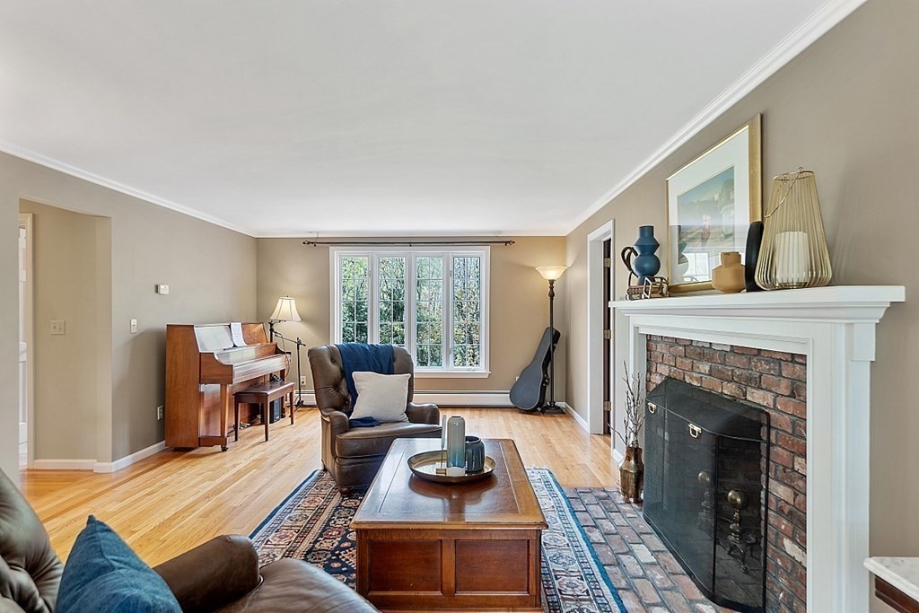 7 Cameron Road Harvard, MA 01451 - Photo 19 of 42 a living room with furniture and a fireplace