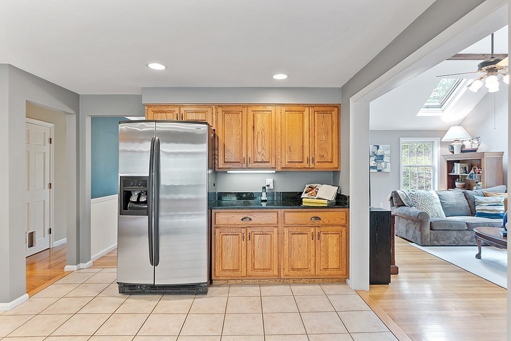 7 Cameron Road Harvard, MA 01451 - Photo 7 of 42 a kitchen with granite countertop a refrigerator and a stove top oven