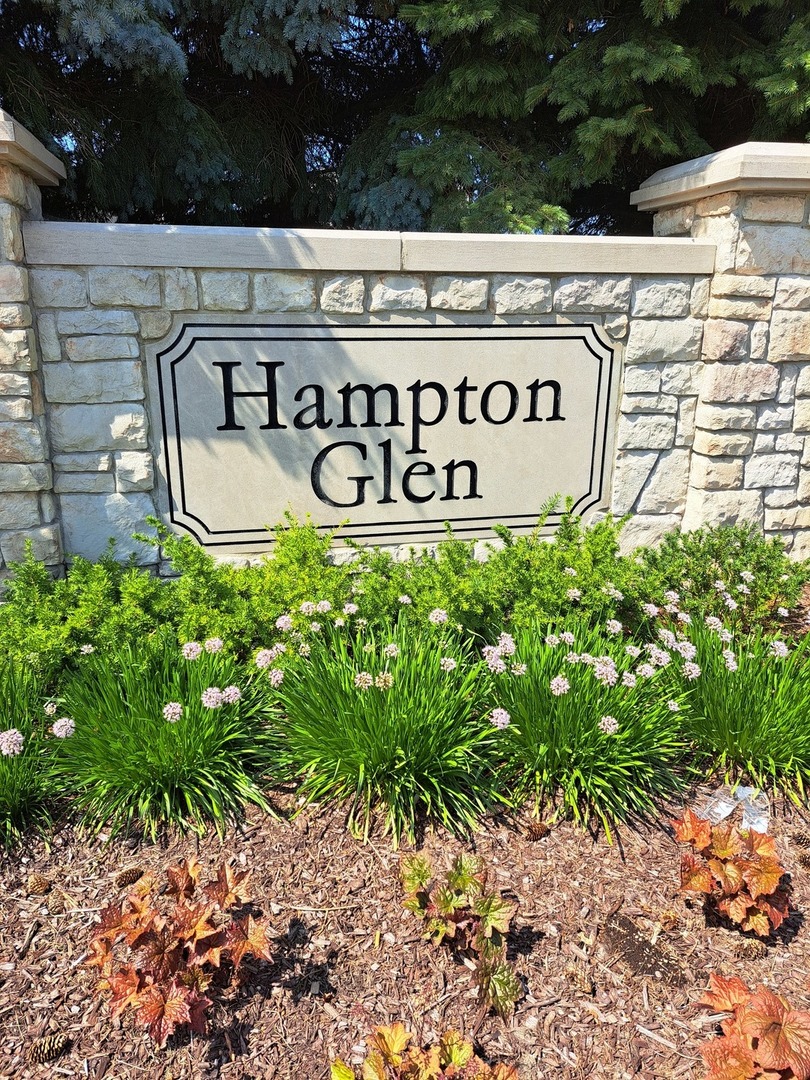 5111 Freeport Court Plainfield, IL 60586 - Photo 2 of 24 a sign on the side of a building